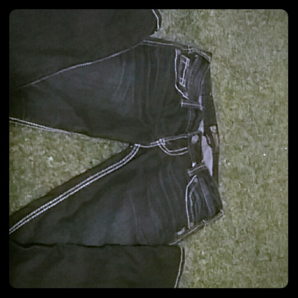 Dark blue with white seaming silver jeans.